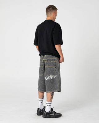 Man wearing Dr. Dot Short Sleeve Tee in Black