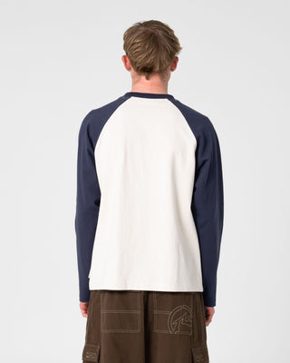 Man wearing Watto Long Sleeve Heavy Tee in Cream
