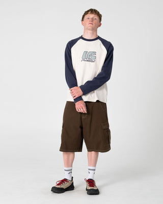 Man wearing Watto Long Sleeve Heavy Tee in Cream
