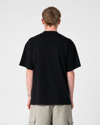 Man wearing Fragment Short Sleeve Tee in Black