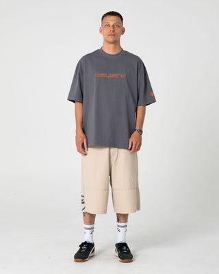 Man wearing Outliner Short Sleeve Tee in Steel