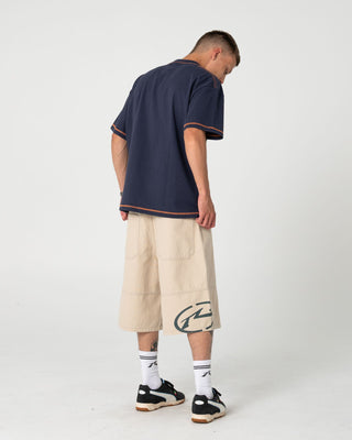 Man wearing Bus Down Short Sleeve Tee in Dark Blue