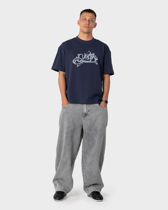 man-wearing-spray-n-pray-short-sleeve-tee-in-dark-blue