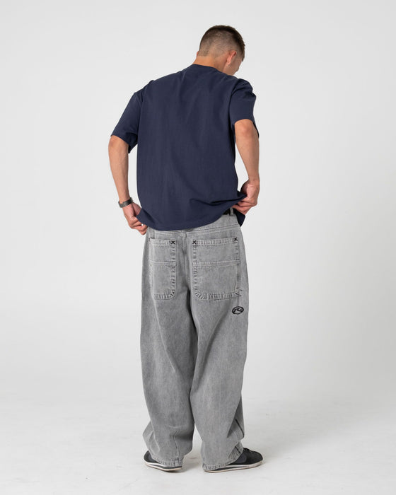 man-wearing-spray-n-pray-short-sleeve-tee-in-dark-blue