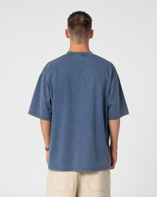 Man wearing Smacko Short Sleeve Tee in Atlantic Blue