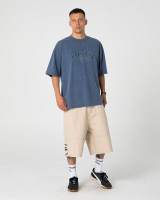 Man wearing Smacko Short Sleeve Tee in Atlantic Blue
