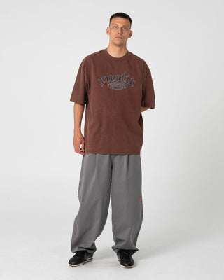 Man wearing Smacko Short Sleeve Tee in Pinecone