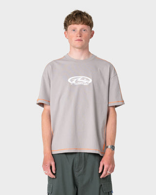 Man wearing Gridlock Short Sleeve Tee in Stone Grey