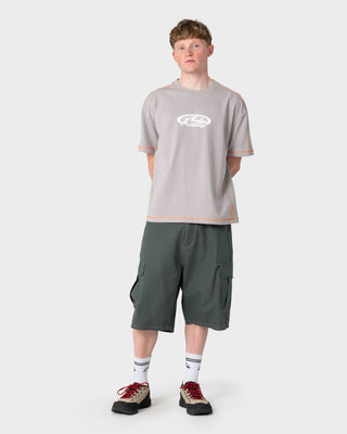 Man wearing Gridlock Short Sleeve Tee in Stone Grey