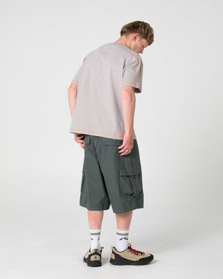 Man wearing Gridlock Short Sleeve Tee in Stone Grey