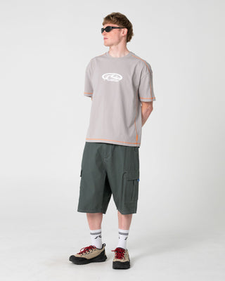 Man wearing Gridlock Short Sleeve Tee in Stone Grey