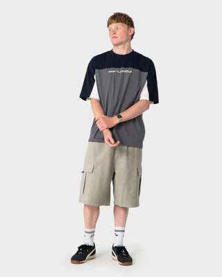 Man wearing Genetika Short Sleeve Tee in Steel