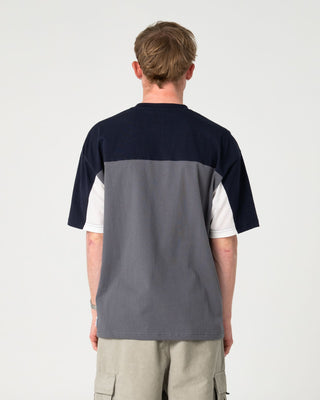 Man wearing Genetika Short Sleeve Tee in Steel