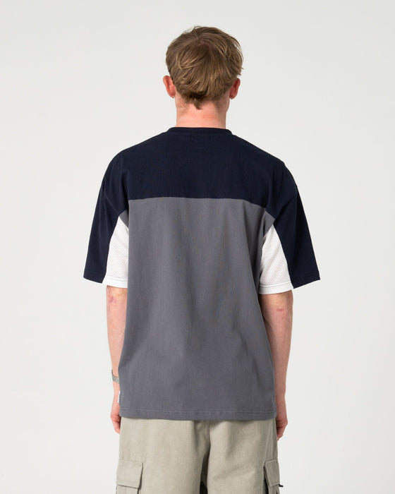 man-wearing-genetika-short-sleeve-tee-in-steel