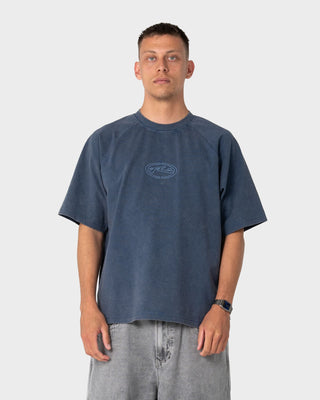 Man wearing Trawla Short Sleeve Tee in Atlantic Blue