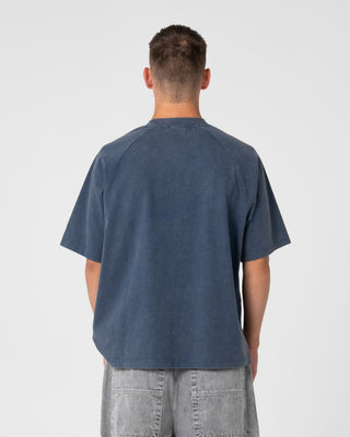Man wearing Trawla Short Sleeve Tee in Atlantic Blue
