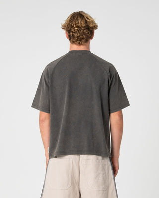 Man wearing Trawla Short Sleeve Tee in Steel