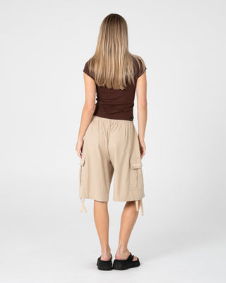 Woman wearing River Low Rise Baggy Cargo Short in Oatmeal