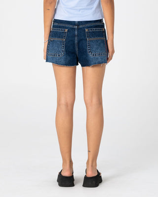 Woman wearing Penny Kick Flare Denim Short 2.0 in Walk Of Shame