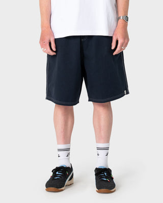 Man wearing Flip Daddy Elastic Baggy Short in Navy Blue