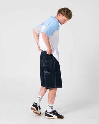 Man wearing Flip Daddy Elastic Baggy Short in Navy Blue