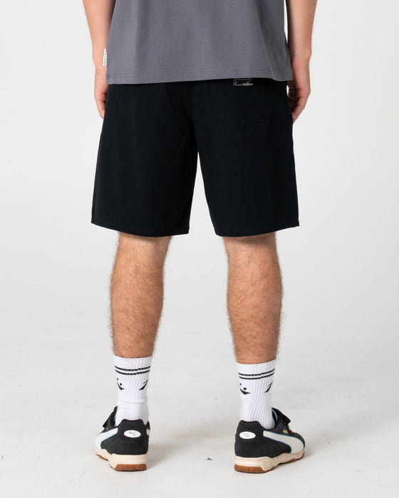 man-wearing-rumble-elastic-short-in-black