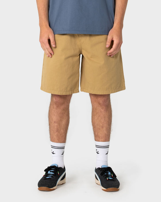 man-wearing-rumble-elastic-short-in-khaki