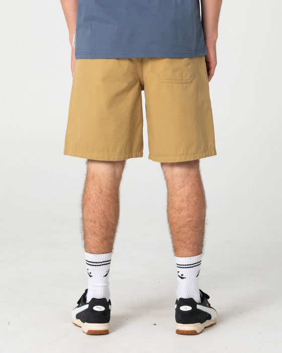 man-wearing-rumble-elastic-short-in-khaki