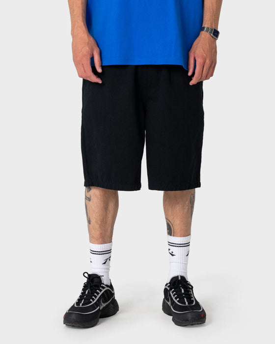 man-wearing-rumble-chino-short-in-black