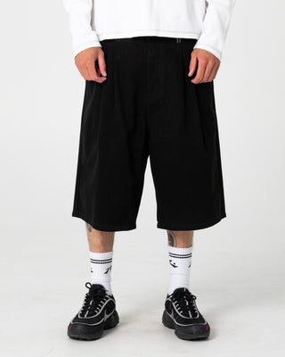 Man wearing Enigma Pleated Short in Black