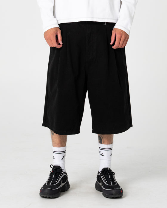 man-wearing-enigma-pleated-short-in-black