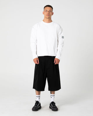 Man wearing Enigma Pleated Short in Black
