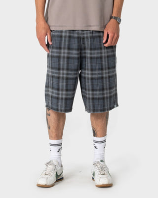 Man wearing X-press Plaid Short in Navy Blue