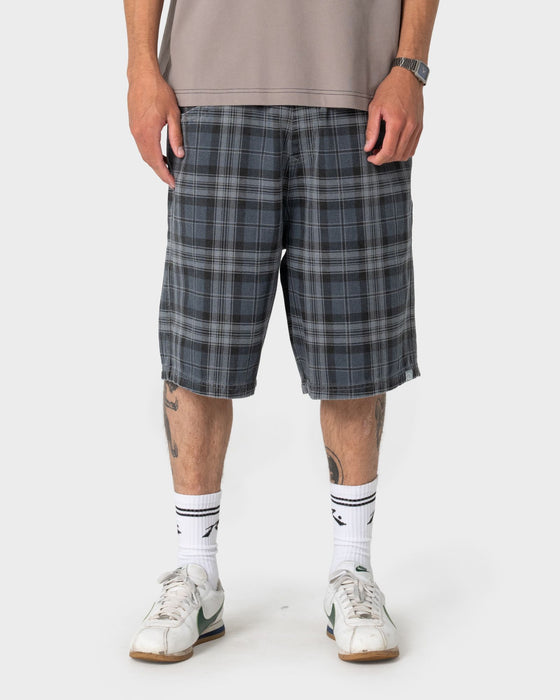 man-wearing-x-press-plaid-short-in-navy-blue
