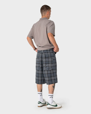 Man wearing X-press Plaid Short in Navy Blue