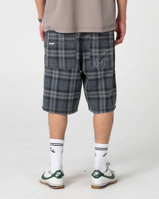 man-wearing-x-press-plaid-short-in-navy-blue