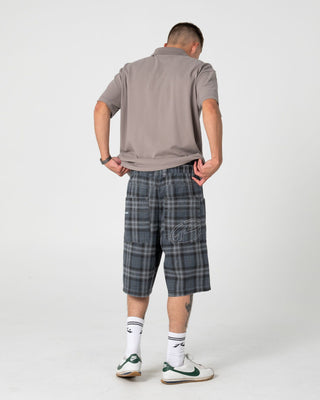 Man wearing X-press Plaid Short in Navy Blue