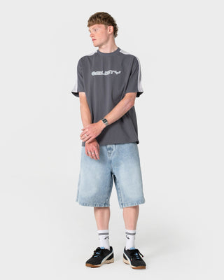 Man wearing Yowie 2.0 Wide Baggy Jort in Blasted True Blue