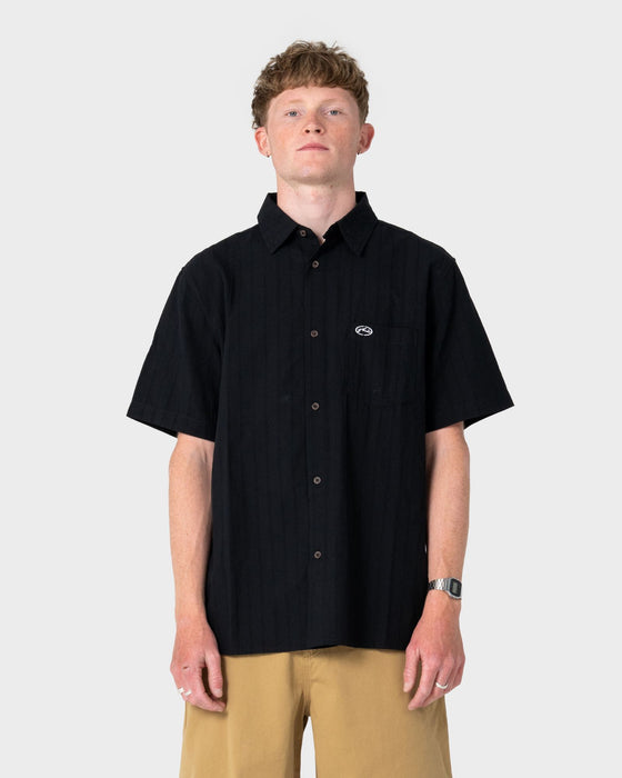 man-wearing-datsun-classic-short-sleeve-shirt-in-black