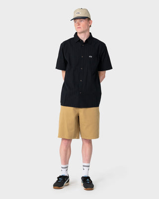 Man wearing Datsun Classic Short Sleeve Shirt in Black