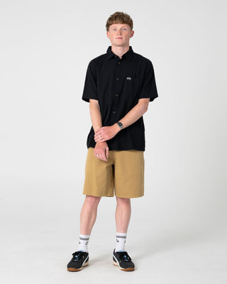 Man wearing Datsun Classic Short Sleeve Shirt in Black