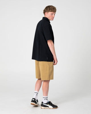 Man wearing Datsun Classic Short Sleeve Shirt in Black