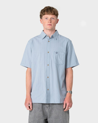 Man wearing Datsun Classic Short Sleeve Shirt in Smoke Blue