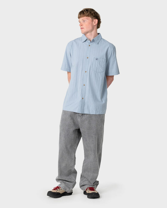 man-wearing-datsun-classic-short-sleeve-shirt-in-smoke-blue