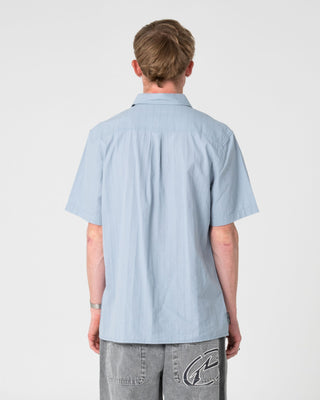 Man wearing Datsun Classic Short Sleeve Shirt in Smoke Blue