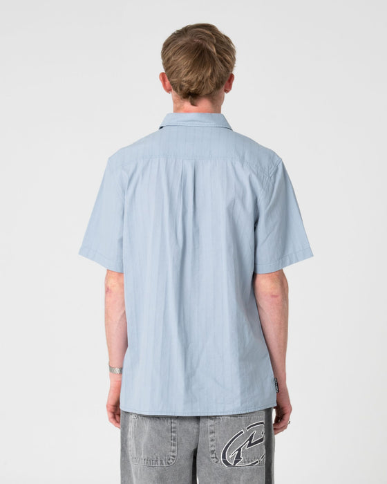 man-wearing-datsun-classic-short-sleeve-shirt-in-smoke-blue