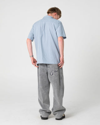 Man wearing Datsun Classic Short Sleeve Shirt in Smoke Blue