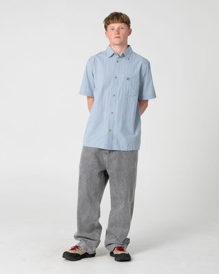 Man wearing Datsun Classic Short Sleeve Shirt in Smoke Blue