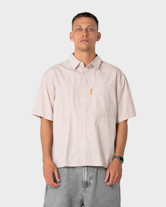 man-wearing-south-central-short-sleeve-shirt-in-ochre