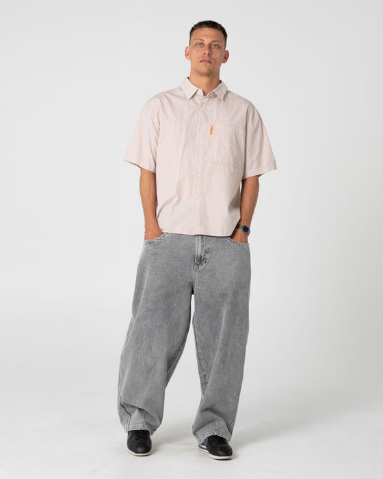 man-wearing-south-central-short-sleeve-shirt-in-ochre
